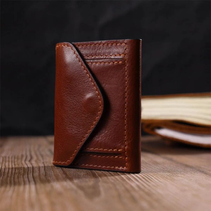 Стильний чоловічий гаманець у три складання Grande Pelle 16786 коричневий