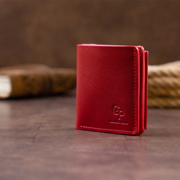 Вертикальне глянсове портмоне з накладною монетницею Grande Pelle 11331 червоне